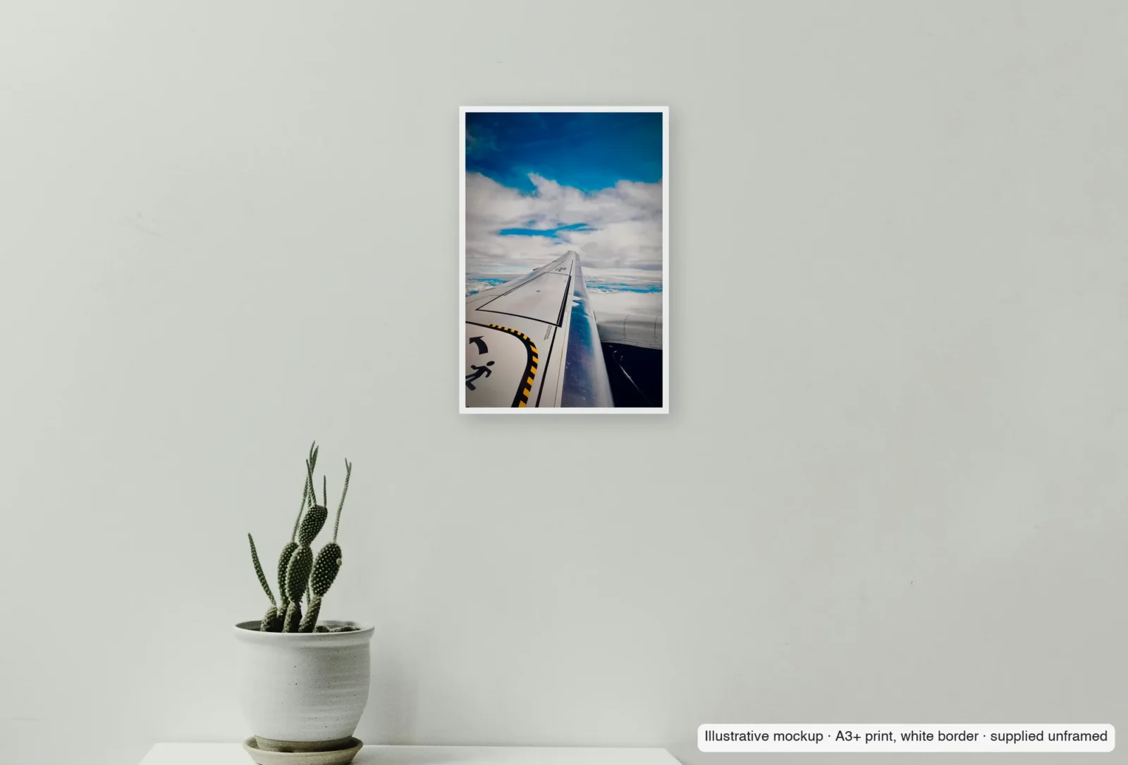 Closer view of Above the cloud deck as an unframed A3+ white-border print above a sideboard.