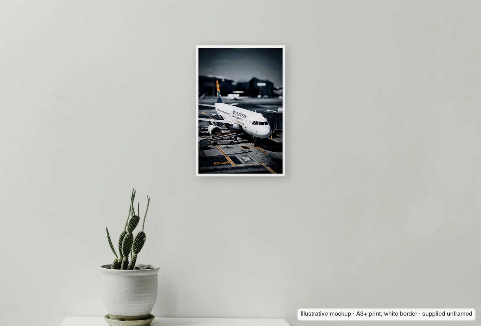 Closer view of At the gate, South African as an unframed A3+ white-border print above a sideboard.