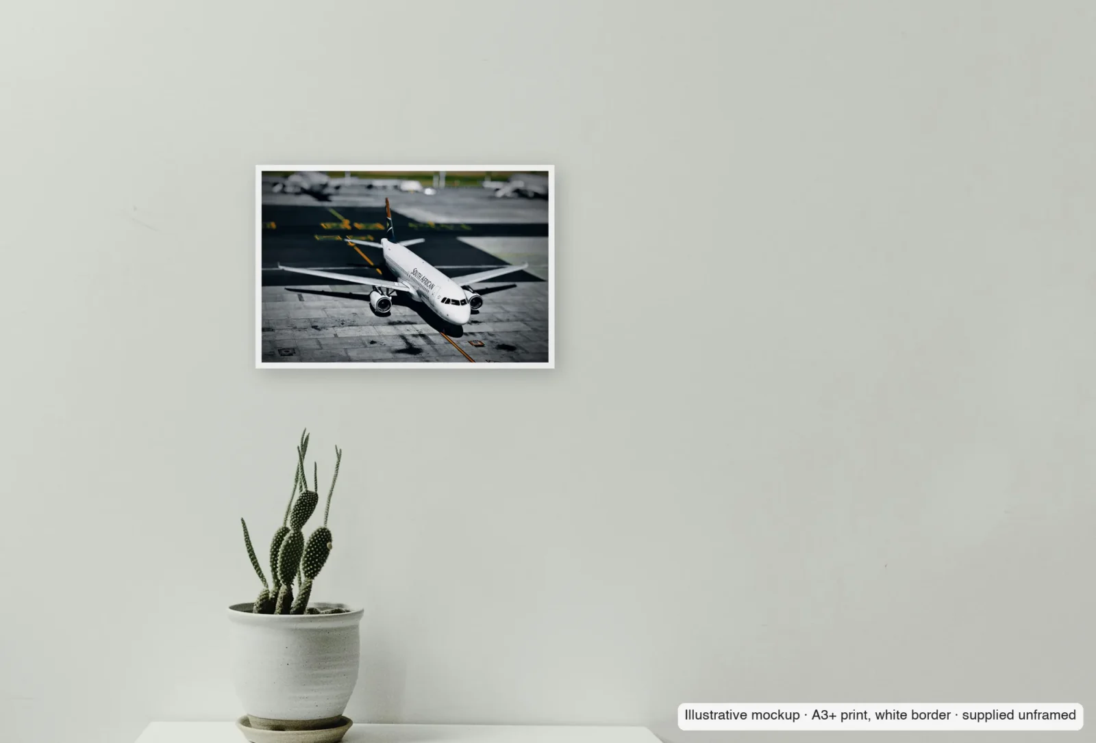 Closer view of Cape Town turn as an unframed A3+ white-border print above a sideboard.