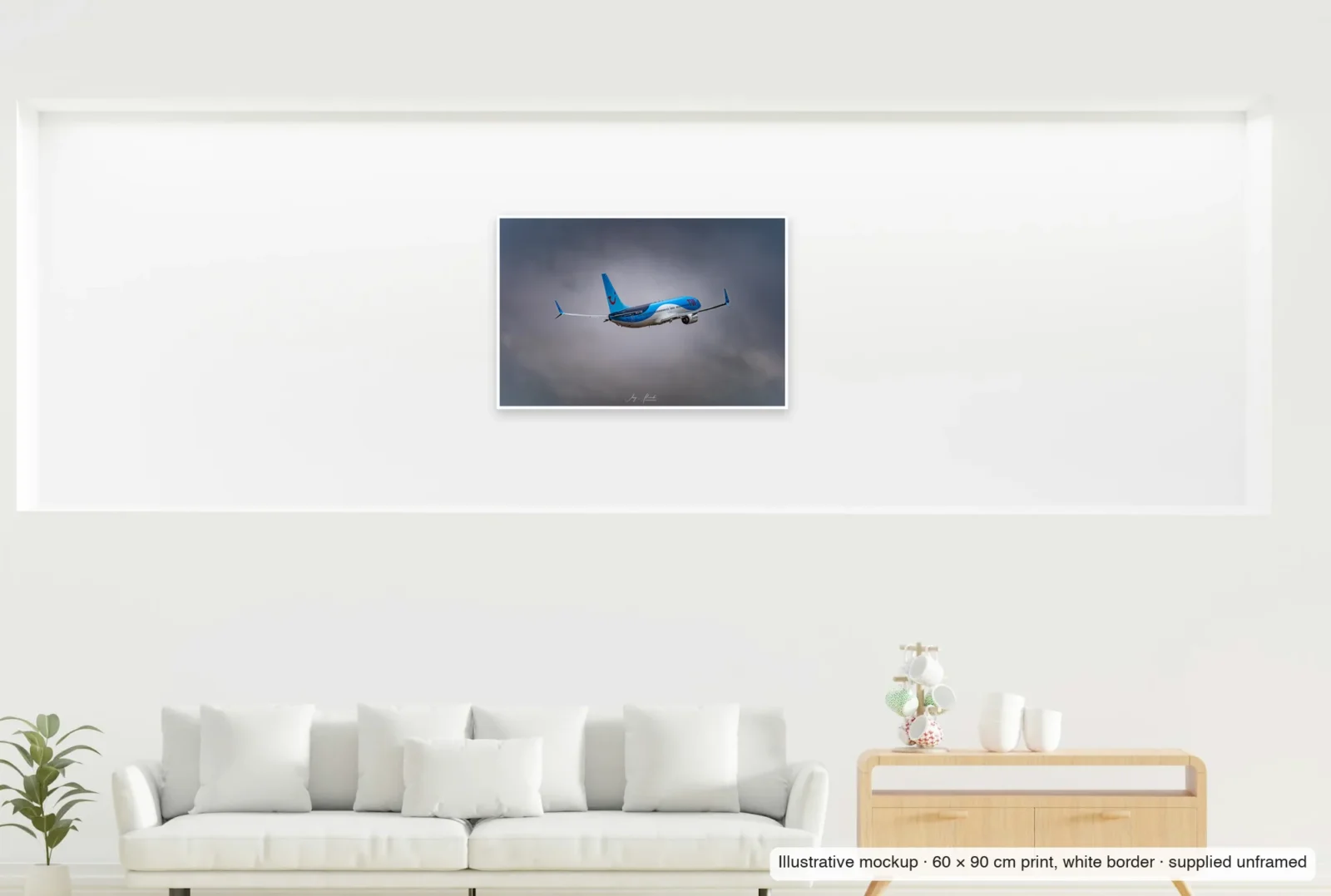 Illustrative mockup showing the scale of Climbing into the storm as an unframed 60 × 90 cm print above a sofa.