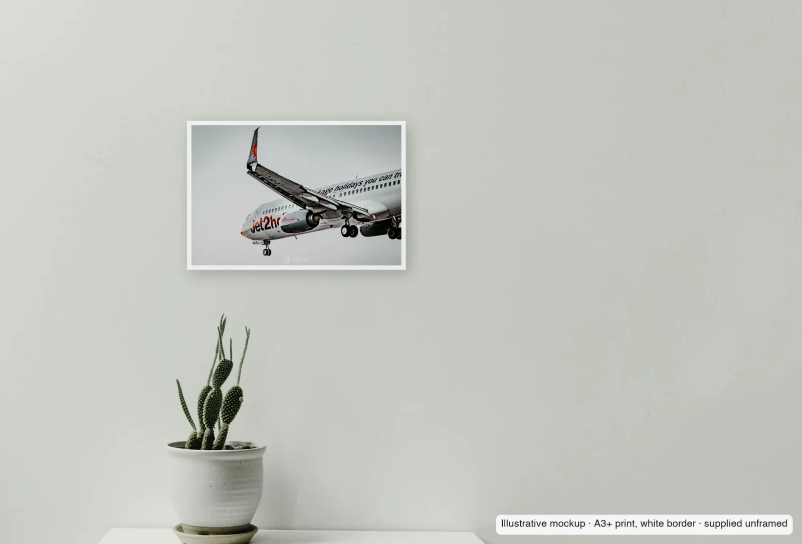 Closer view of Flaps down, gear down as an unframed A3+ white-border print above a sideboard.