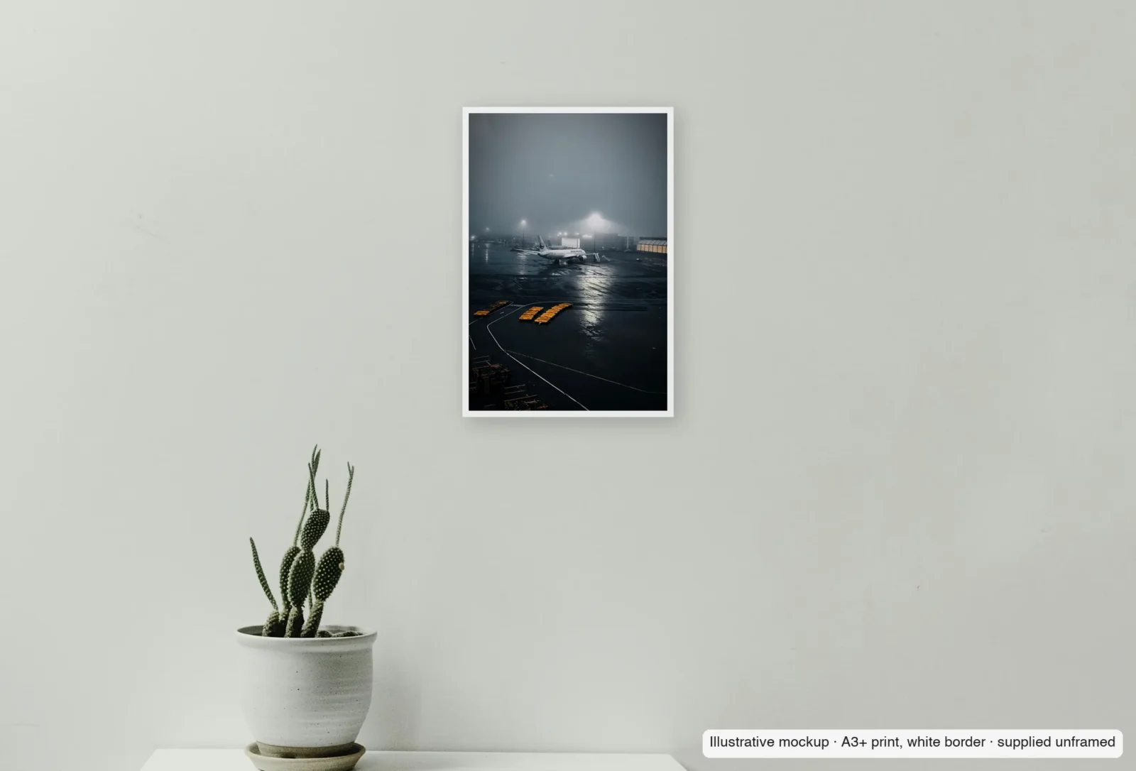Closer view of Fog at Logan as an unframed A3+ white-border print above a sideboard.