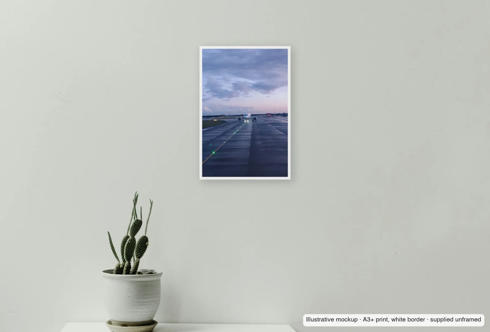 Closer view of Lights on the centreline as an unframed A3+ white-border print above a sideboard.
