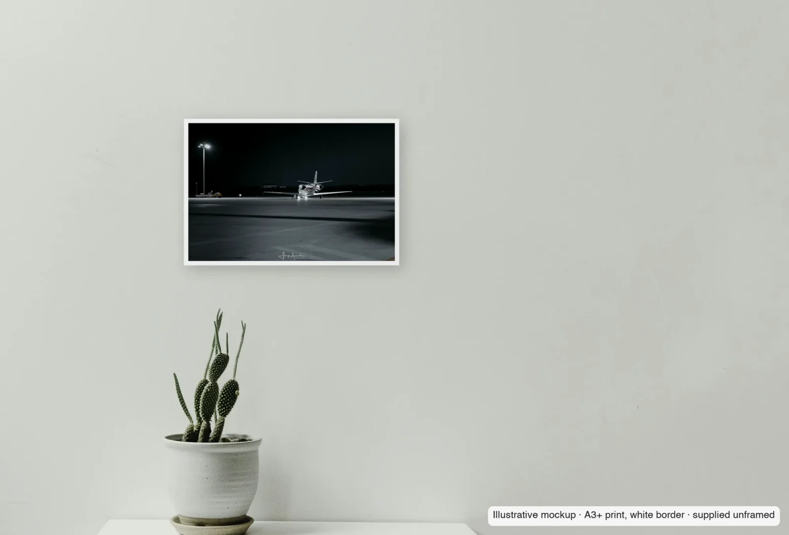 Closer view of Lone taxi as an unframed A3+ white-border print above a sideboard.