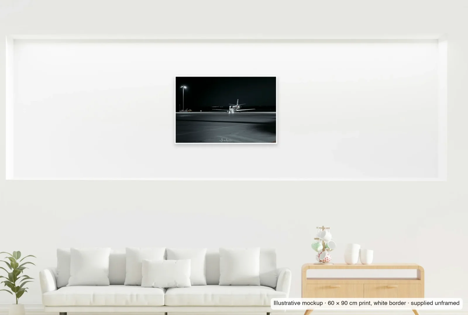 Illustrative mockup showing the scale of Lone taxi as an unframed 60 × 90 cm print above a sofa.