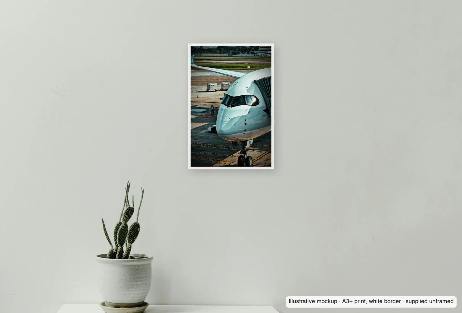 Closer view of Morning at Changi as an unframed A3+ white-border print above a sideboard.