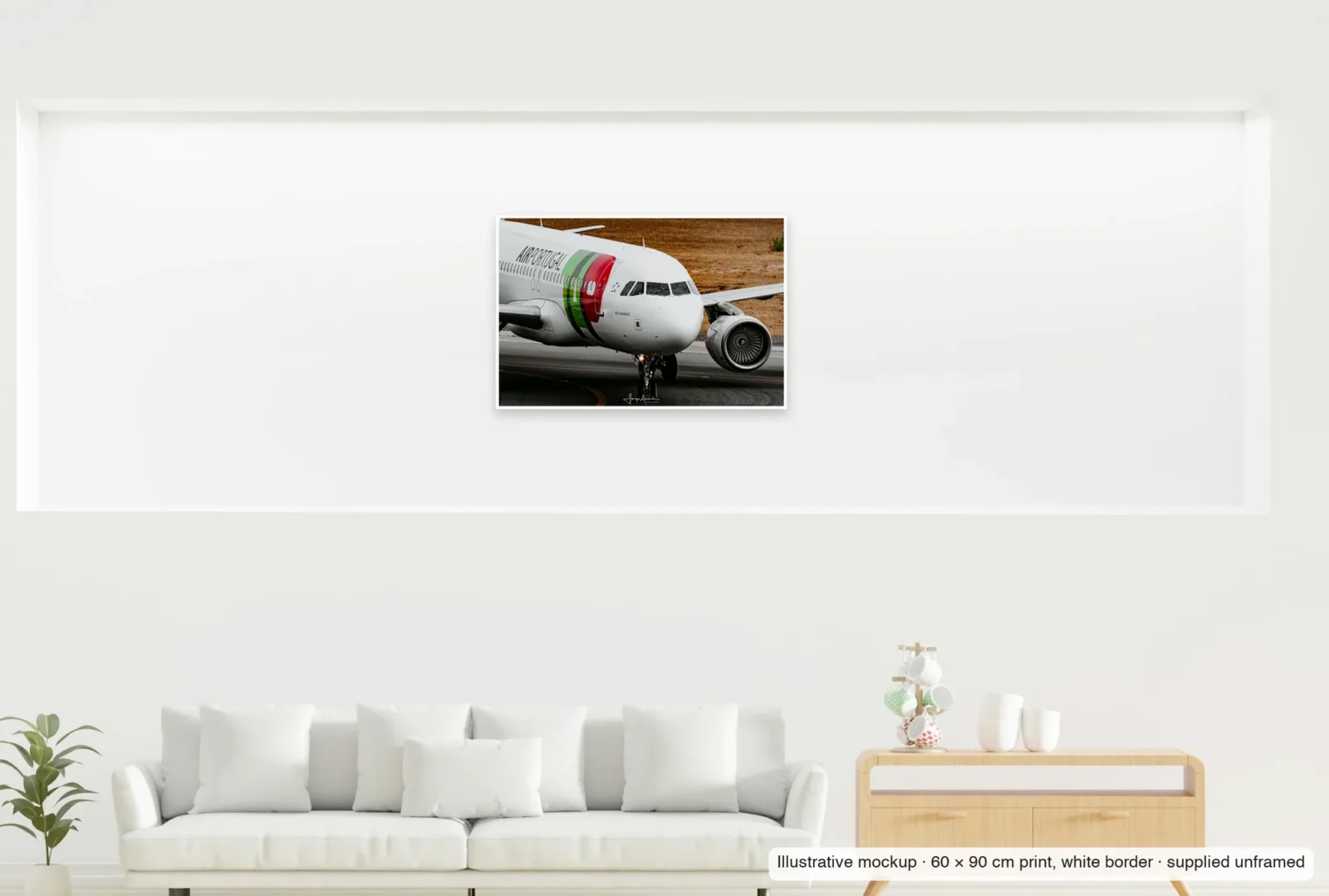 Illustrative mockup showing the scale of Named for a novelist as an unframed 60 × 90 cm print above a sofa.