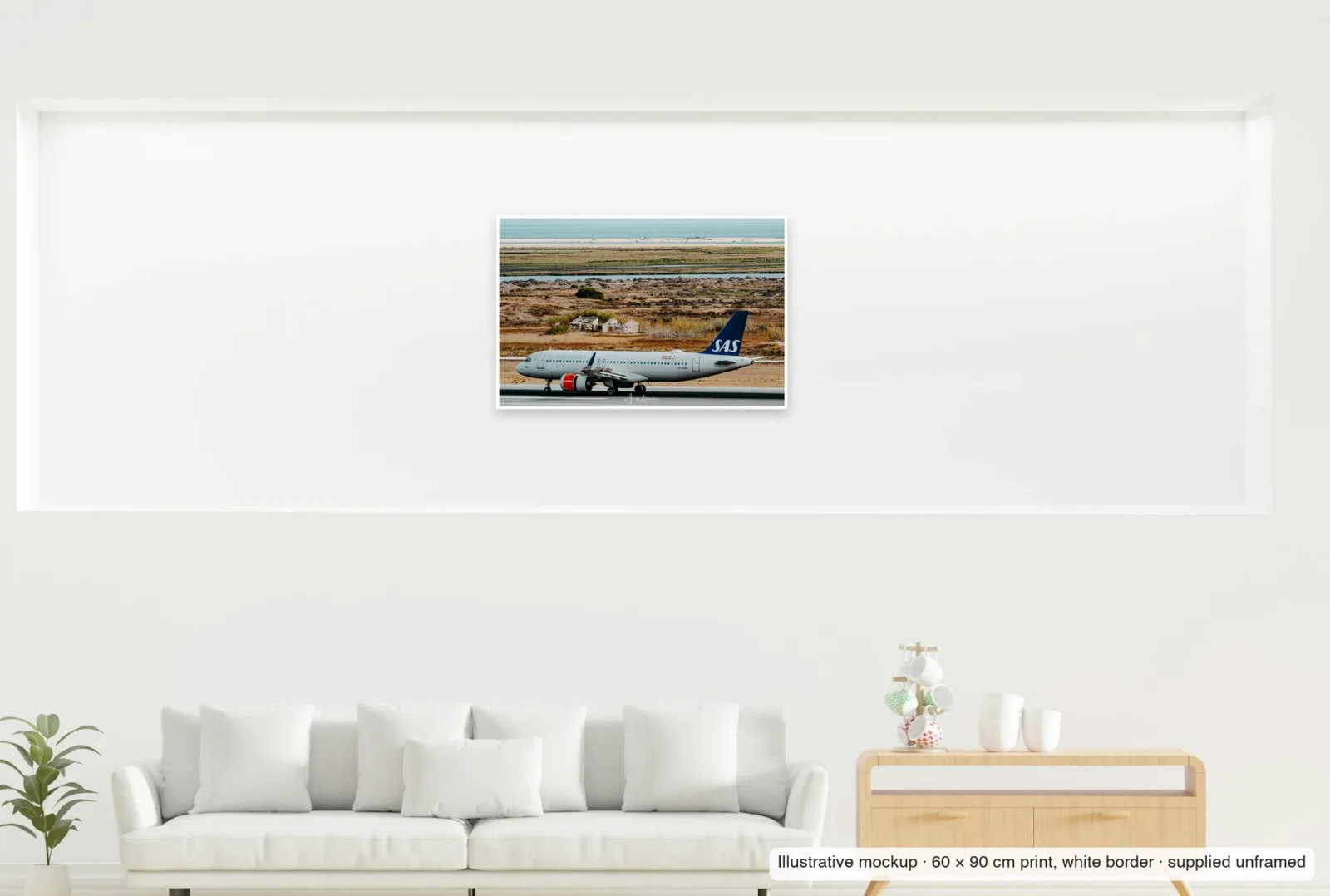 Illustrative mockup showing the scale of North meets south as an unframed 60 × 90 cm print above a sofa.