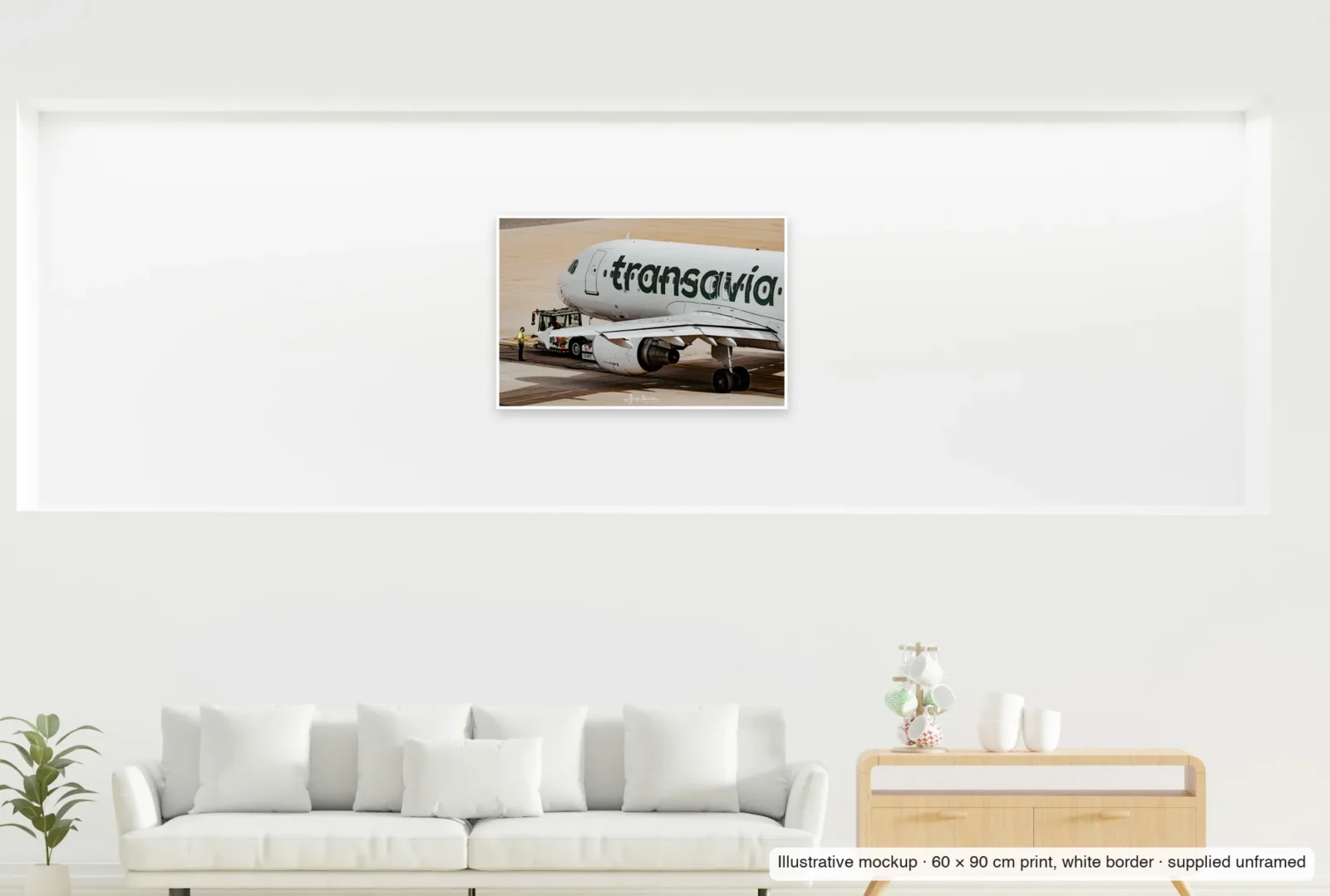 Illustrative mockup showing the scale of Pushback as an unframed 60 × 90 cm print above a sofa.