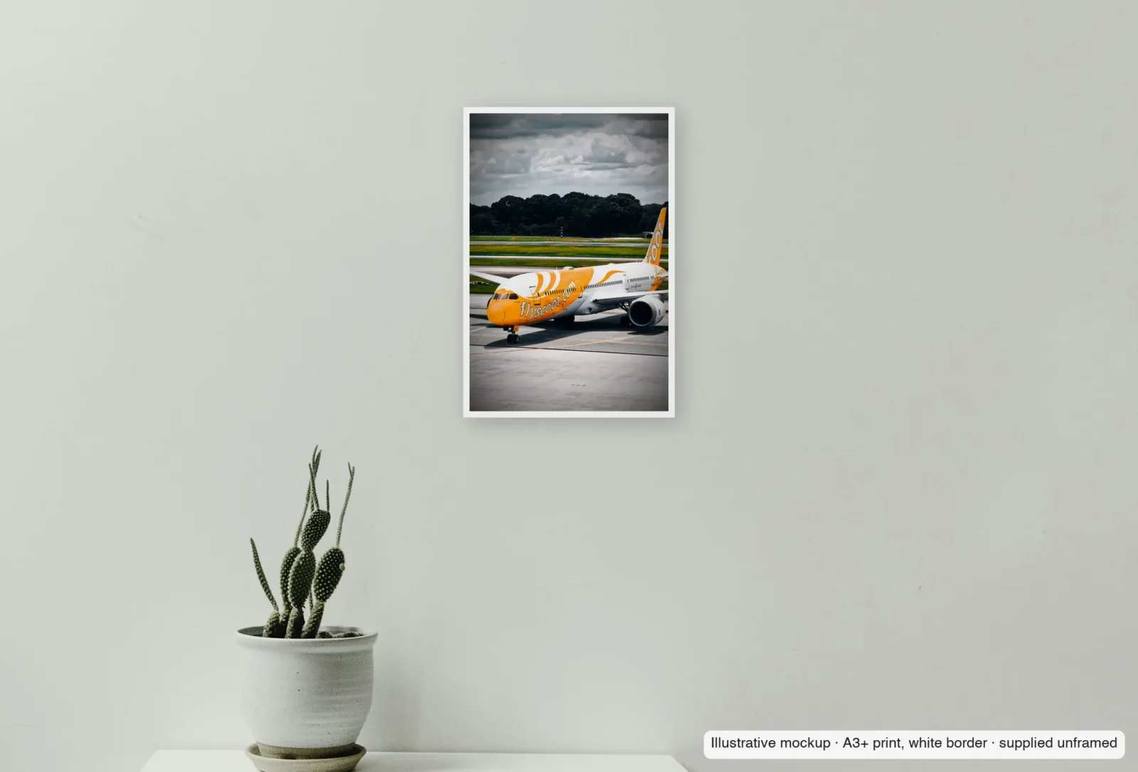 Closer view of Scoot under a heavy sky as an unframed A3+ white-border print above a sideboard.