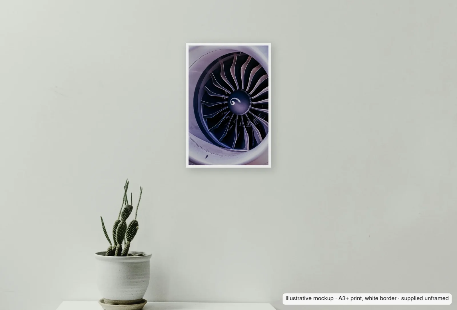Closer view of Spiral heart as an unframed A3+ white-border print above a sideboard.