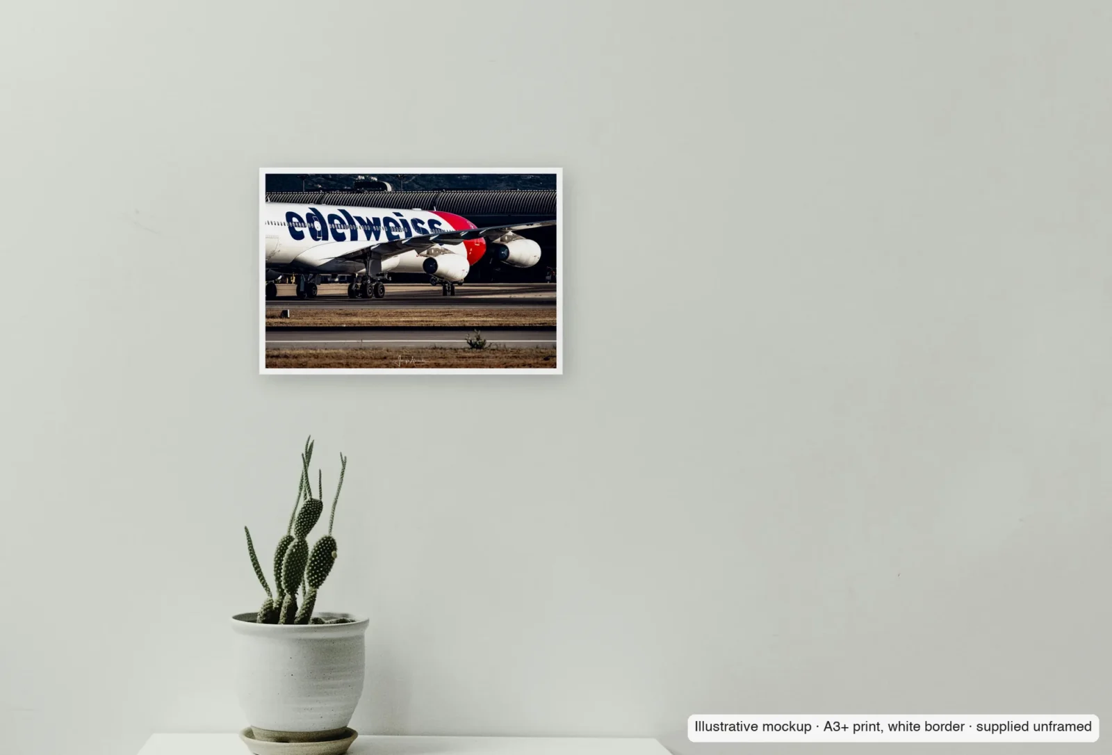 Closer view of The four-engined profile as an unframed A3+ white-border print above a sideboard.