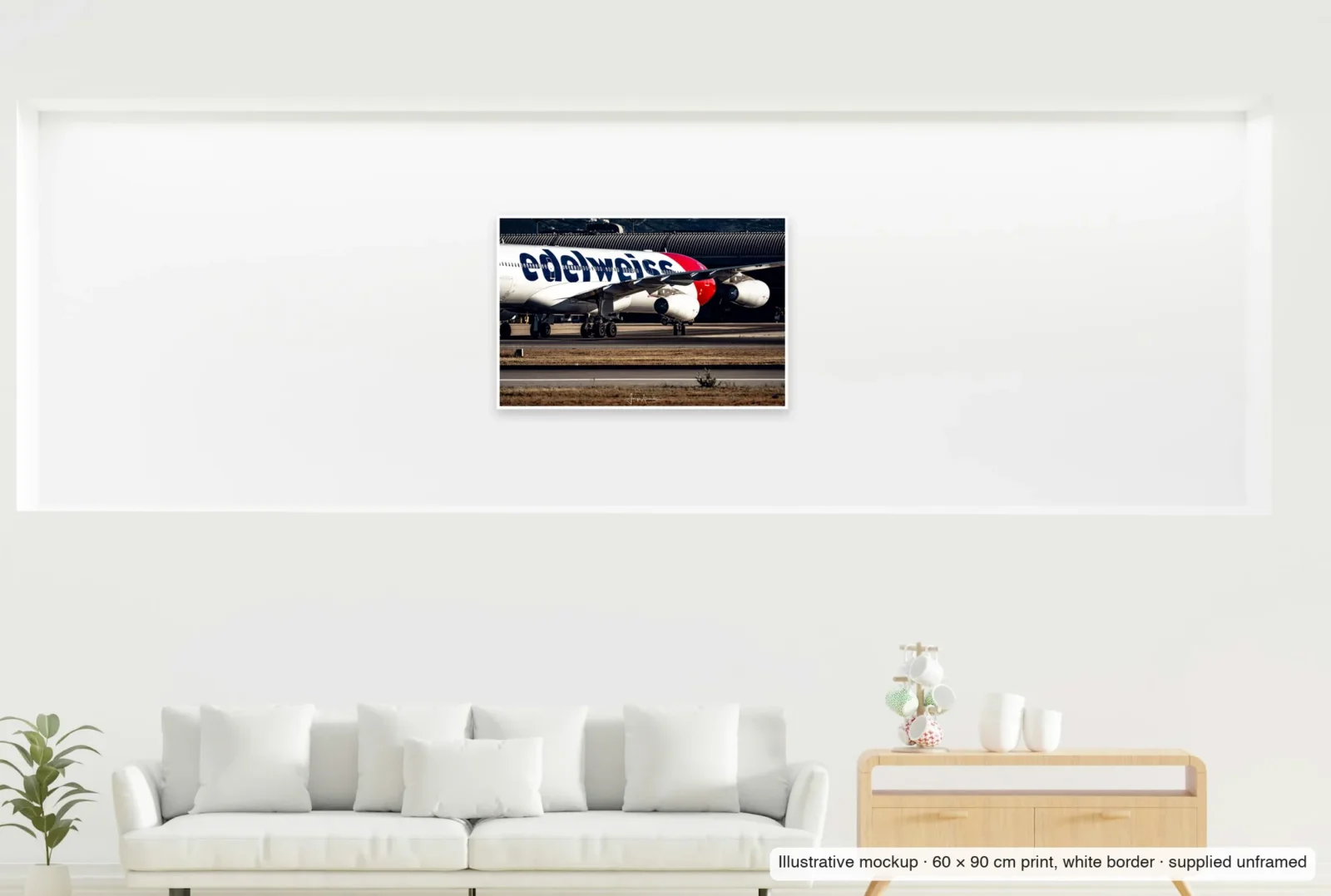 Illustrative mockup showing the scale of The four-engined profile as an unframed 60 × 90 cm print above a sofa.