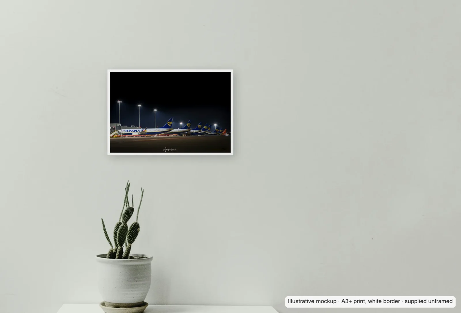 Closer view of The long line as an unframed A3+ white-border print above a sideboard.
