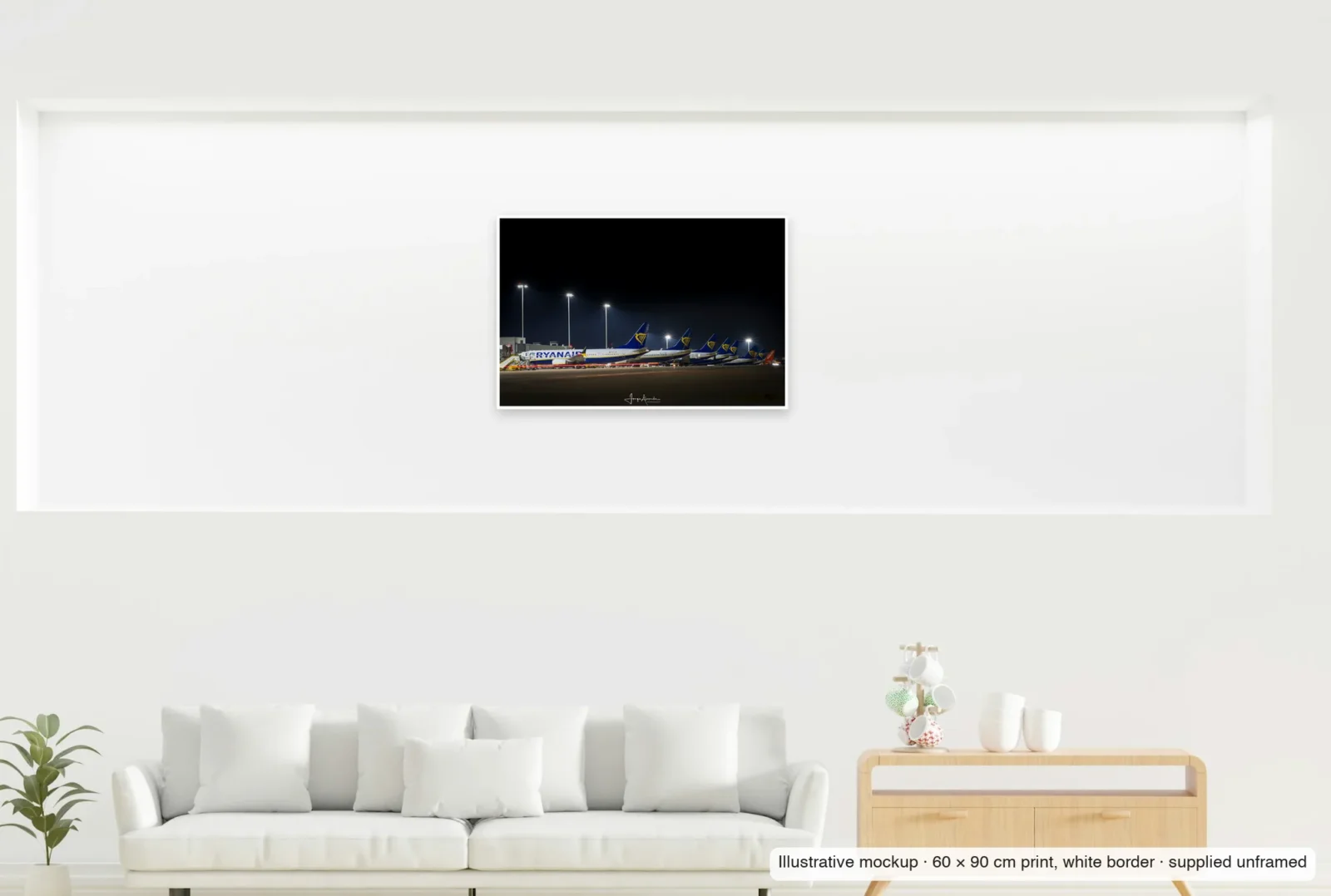 Illustrative mockup showing the scale of The long line as an unframed 60 × 90 cm print above a sofa.