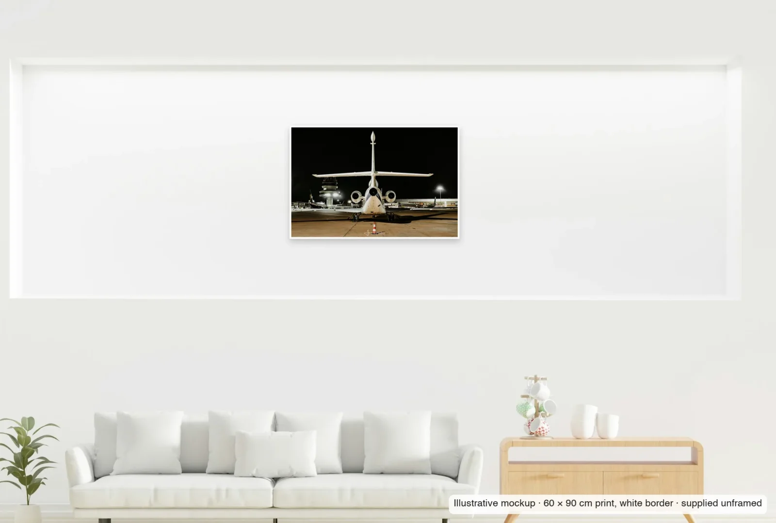Illustrative mockup showing the scale of Tower watch as an unframed 60 × 90 cm print above a sofa.