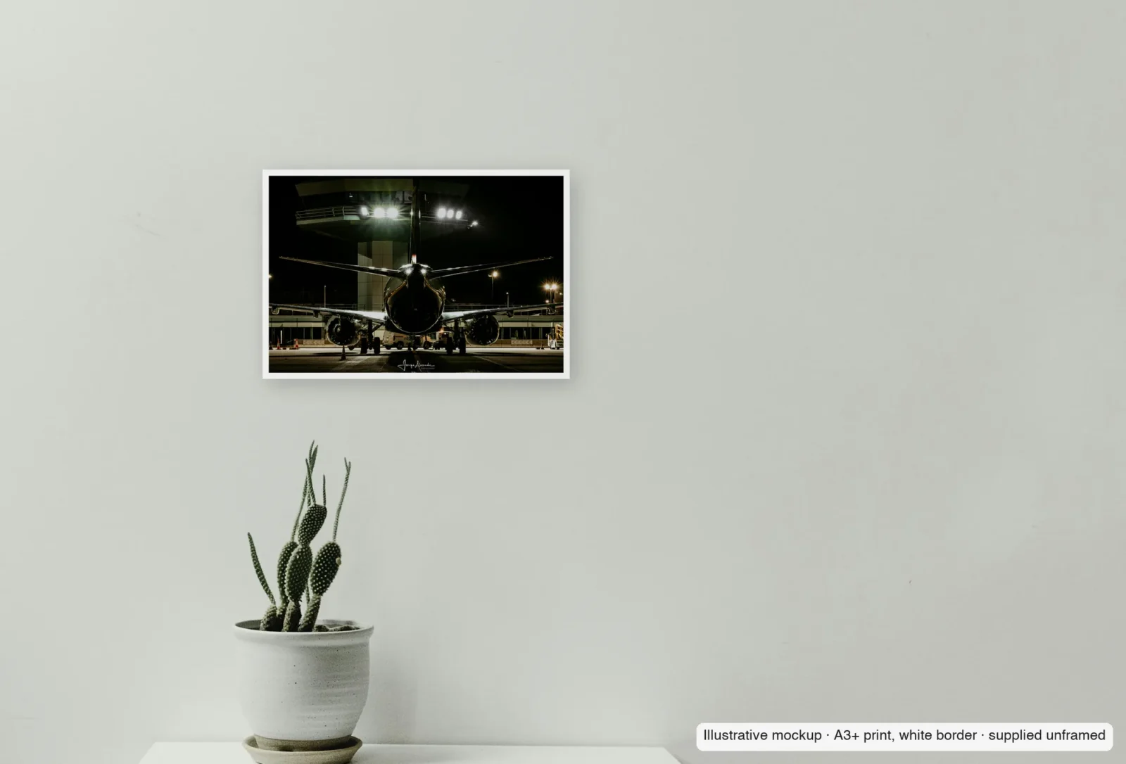 Closer view of Under the floodlights as an unframed A3+ white-border print above a sideboard.