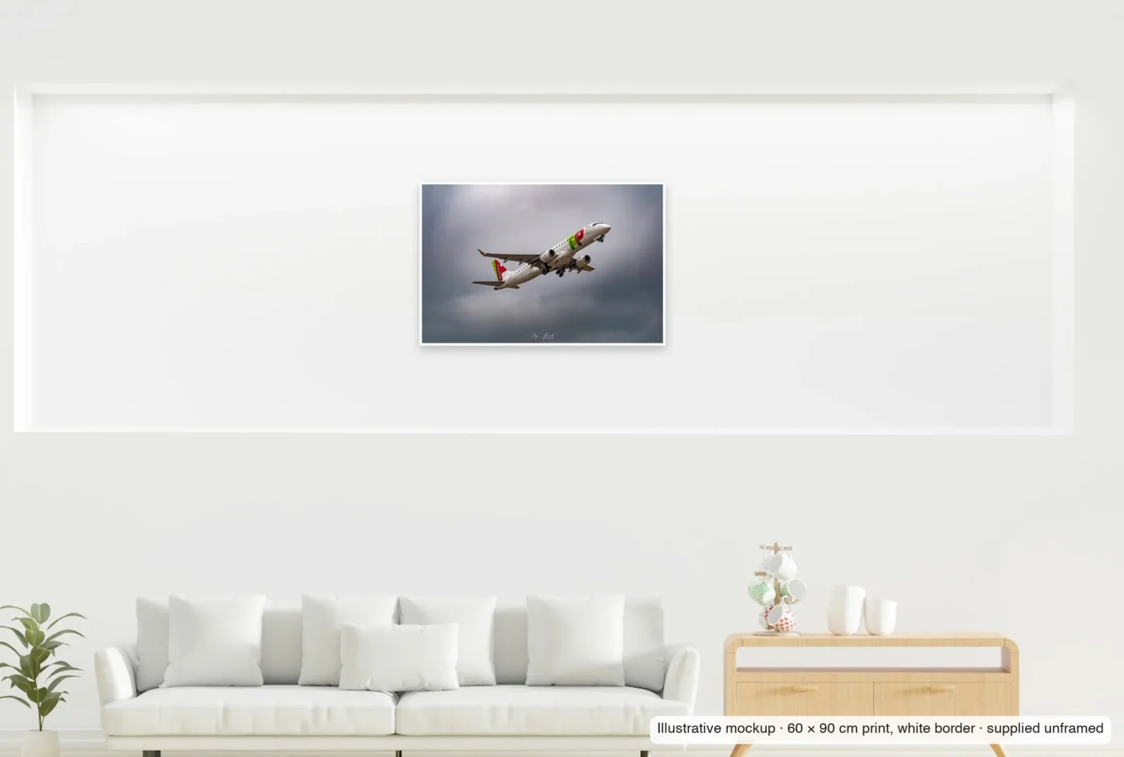 Illustrative mockup showing the scale of Viseu takes to the sky as an unframed 60 × 90 cm print above a sofa.
